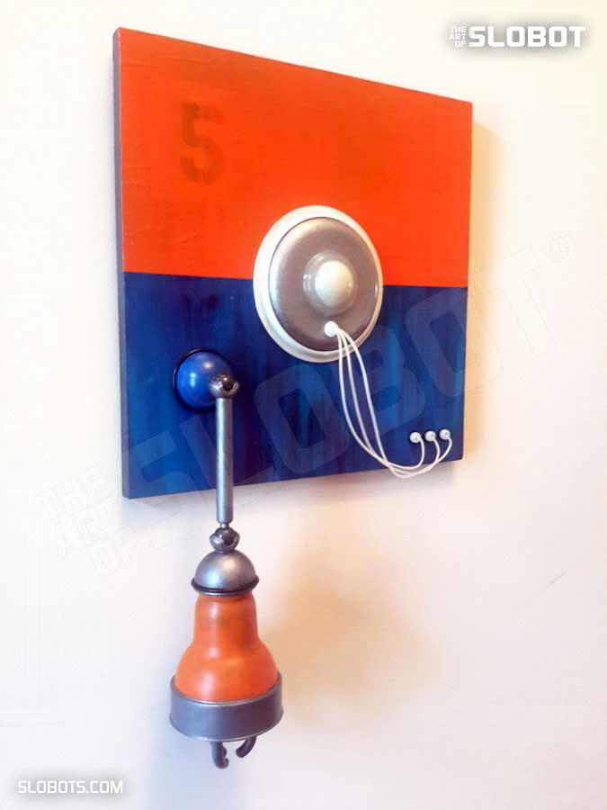 Mike Slobot Robot Painting Number 5 in Orange, Blue, and Violet from Left