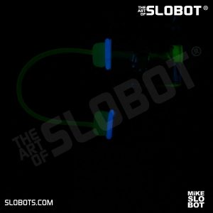 Mike Slobot slomikro Maroon and Clear Blue small robot art glow in the dark